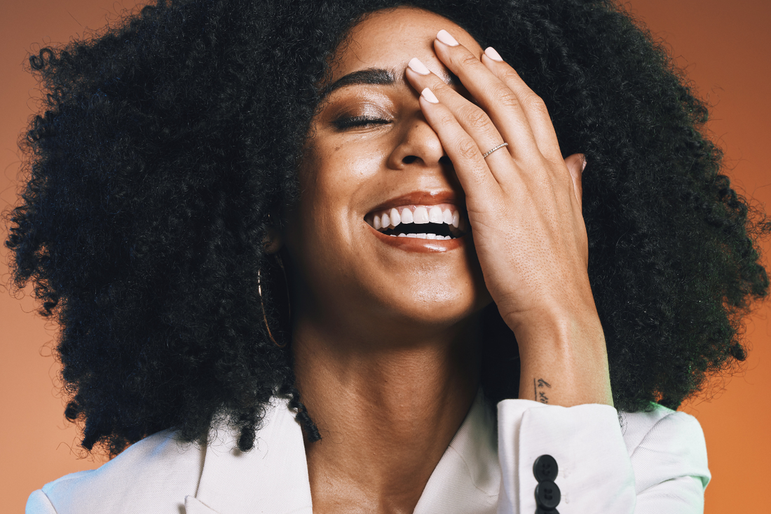 Healthy, natural curls reflecting strong, consistent hair growth