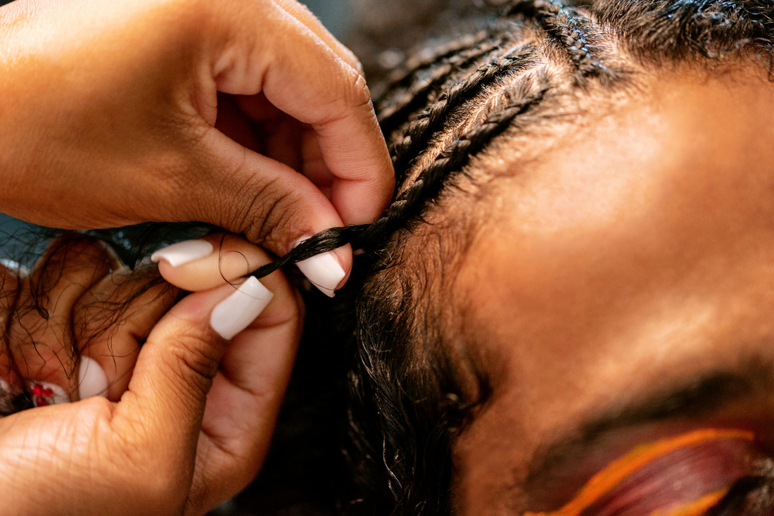 Protective braiding technique showing low-tension styling as part of a healthy hair routine