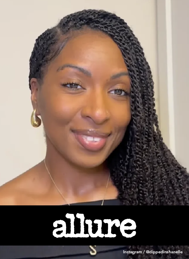 Woman with long black mini twists wearing a black off-shoulder top and gold hoop earrings, with the Allure logo displayed below. Photo courtesy of Instagram at dippedinshanelle.